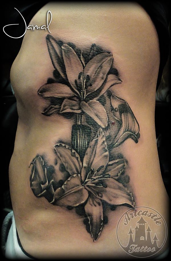 ArtCastleTattoo Tattoo ArtiestJamal Realistic Flower on the ribs Black n Grey