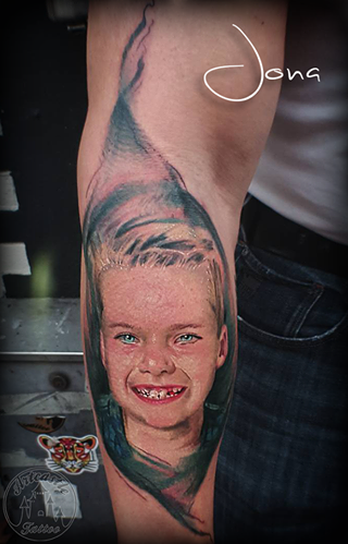 ArtCastleTattoo Tattoo ArtiestJona Realistic childs portrait on arm with background in full color realism Portrait