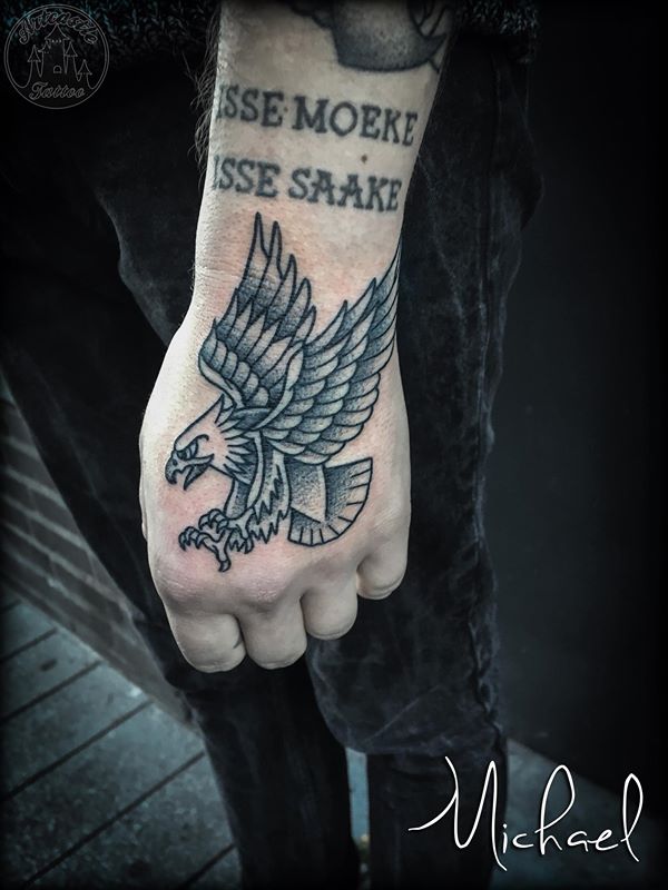 ArtCastleTattoo Tattoo ArtiestMichael American Traditional eagle in black n grey on hand Old School