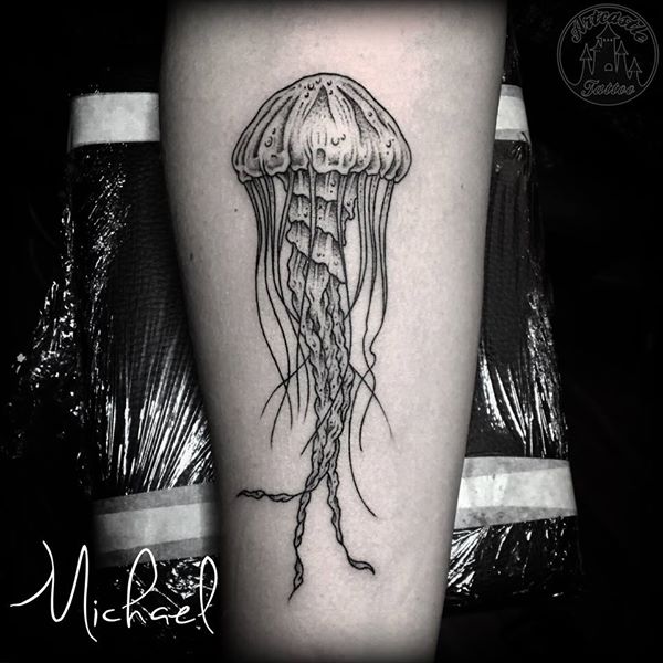 ArtCastleTattoo Tattoo ArtiestMichael Jellyfish tattoo with fine lines lower arm Blackwork