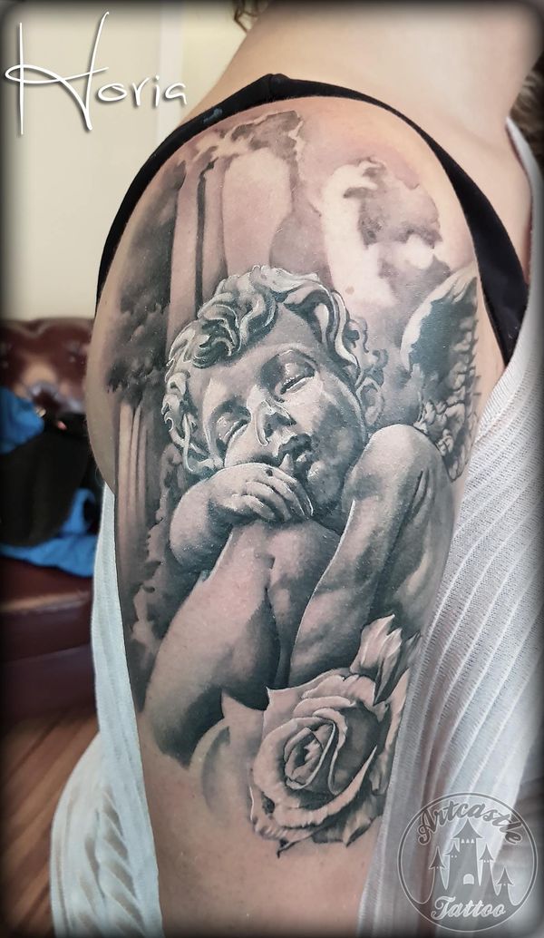 ArtCastleTattoo Tattoo ArtiestPrive Horia Realistic black n grey angel cherub on arm with rose tattoo upper arm Black n Grey